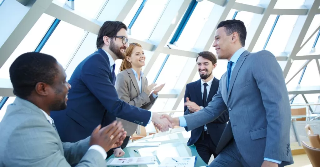 Two parties in agreement shaking hands